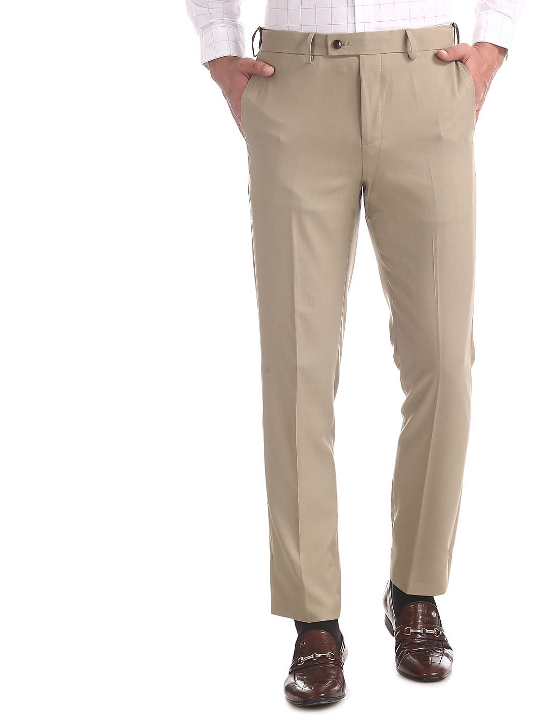 Buy Arrow Beige Tapered Fit Flat Front Trousers - NNNOW.com