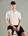 Tommy Hilfiger Solid Regular Fit Cotton Polo T-Shirt